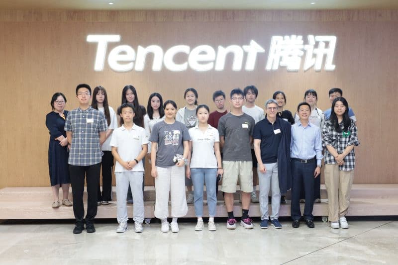 Young professionals group photo at Tencent headquarters in Beijing